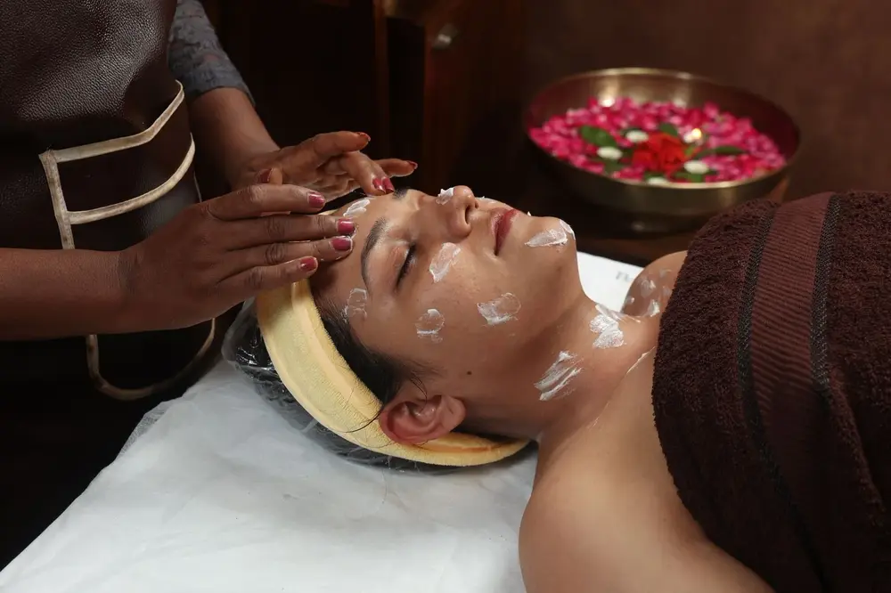 Face massage with herbal cream