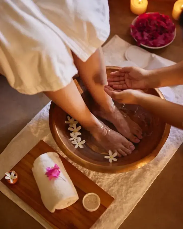 Herbal foot soak in a copper bowl