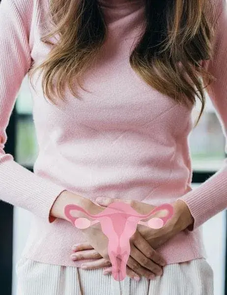 Woman holding her lower abdomen