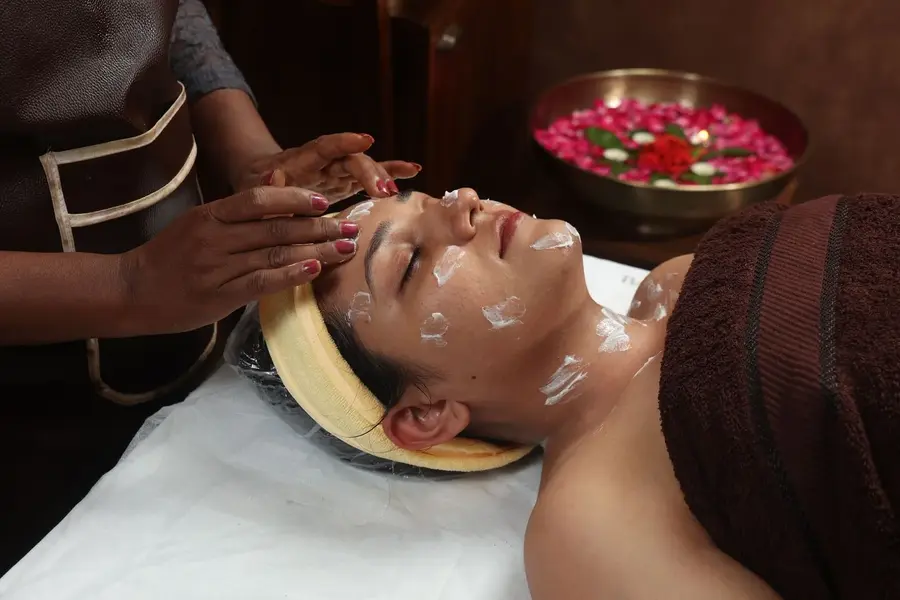 Face massage with herbal cream